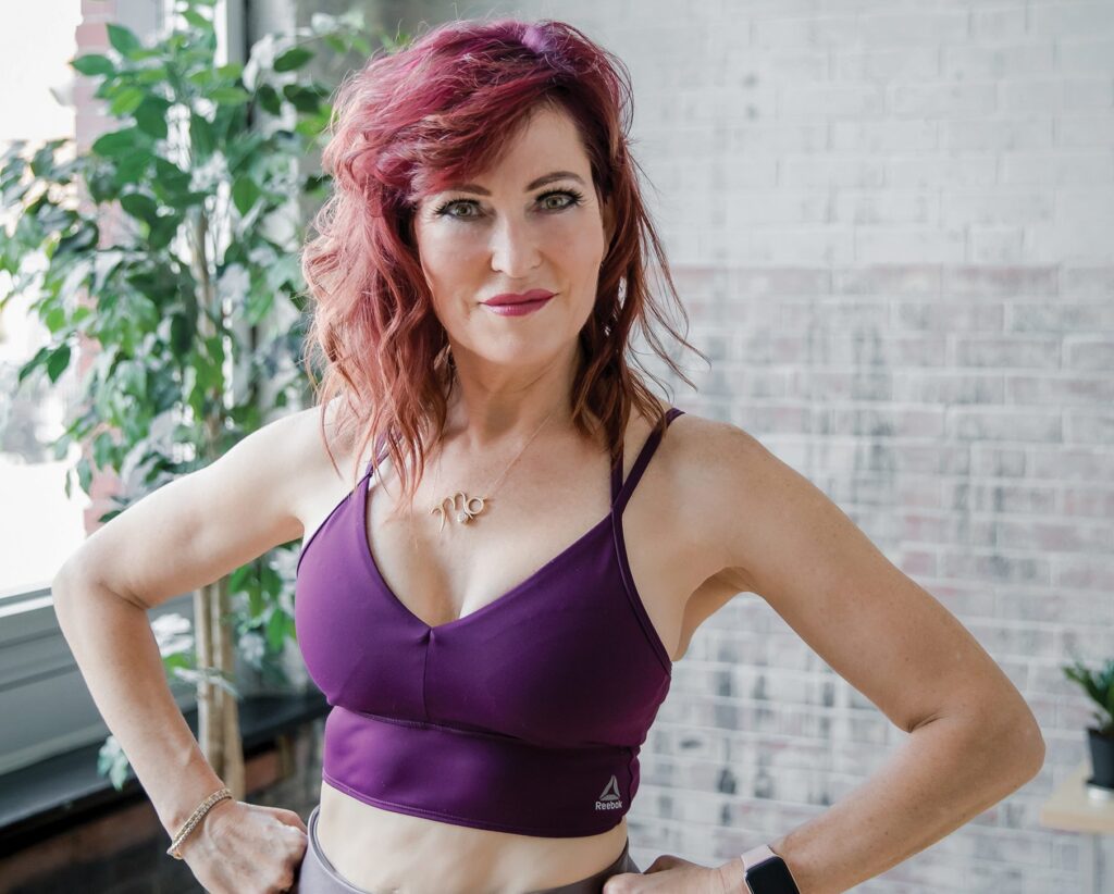 Mo Hagan with hands on her hips and posing for the camera.